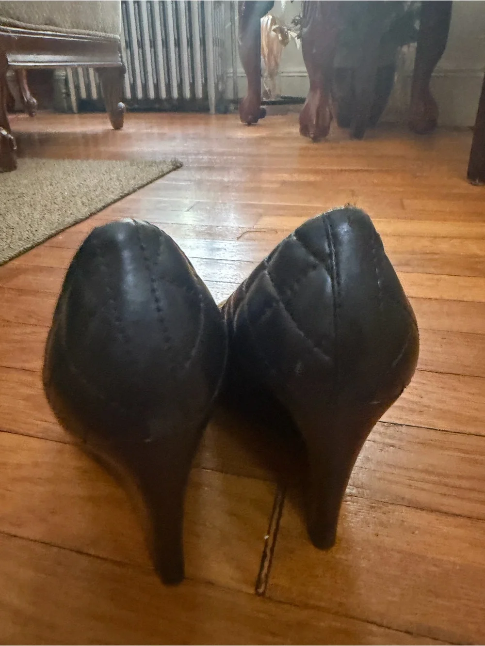 Tory Burch Black Quilted Leather Pumps with Gold Toe Cap Accent